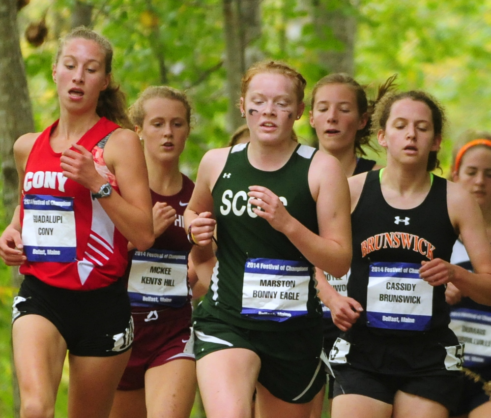 Cony’s Anne Guadalupi, left, Bonny Eagle’s Kialeigh Marston, center, and Brunswick’s Tessa Cassidy are among the early leaders in the girls’ race Saturday in Belfast.