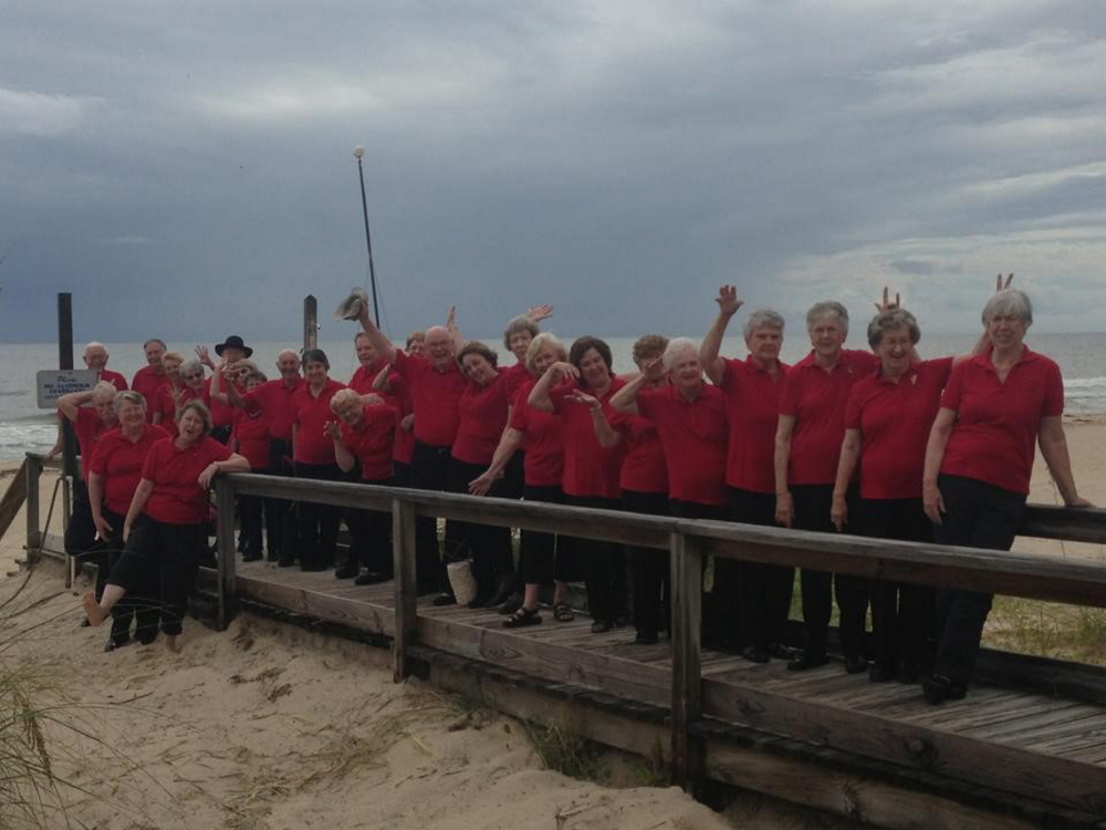 The First Joy Senior Adult Choir of the First Baptist Church of Tallahassee, Fla., step out for a some beach time. The 40-plus member group takes semi-annual  trips around the country to sing and to serve others. One of their specialties has been building handicap accessible ramps.