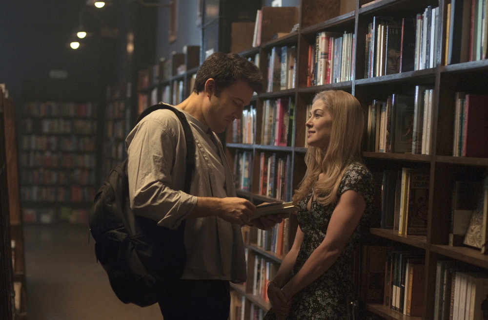 Ben Affleck and Rosamund Pike appear in a scene from “Gone Girl.” The movie grossed $38 million in its U.S. debut.