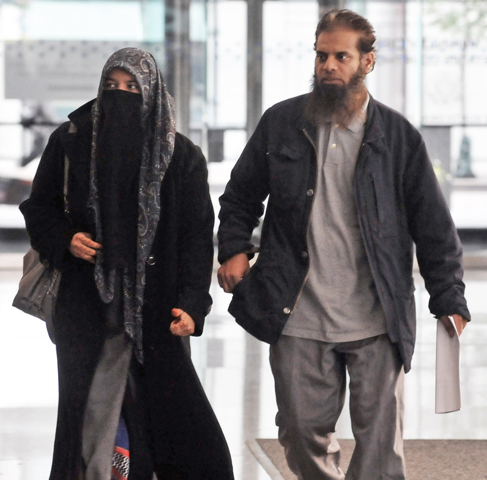 The parents of Mohammed Hamzah Khan, a 19-year-old U.S. citizen from Bolingbrook, Ill., leave the Dirksen federal building Chicago on Monday. Their son, Mohammed Hamzah Khan, was arrested Saturday at O’Hare International Airport, from where he intended to fly to Turkey so he could sneak into Syria to join the Islamic State, according to a criminal complaint released Monday.
