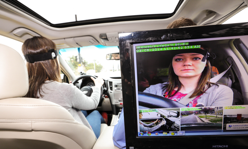 A driver takes part in a distracted-driving test, as two new studies find voice-activated systems for music, navigation and cellphones actually degrade a driver’s attention to traffic.