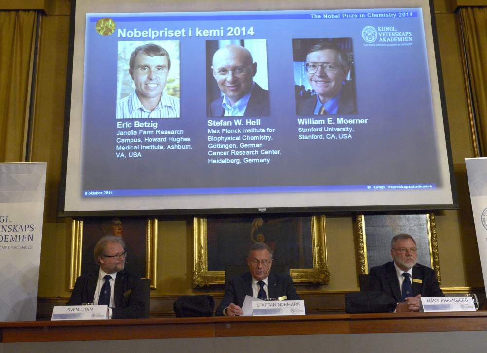 Sven Lidin, left , Staffan Nordmark, centre,  and Mans Ehrenberg at the  Royal Academy of Sciences  Wednesday, announce the Nobel Chemistry laureates 2014. Americans Eric Betzig and William Moerner and German scientist Stefan Hell  won the Nobel Prize in Chemistry for “the development of super-resolved fluorescence microscopy.”