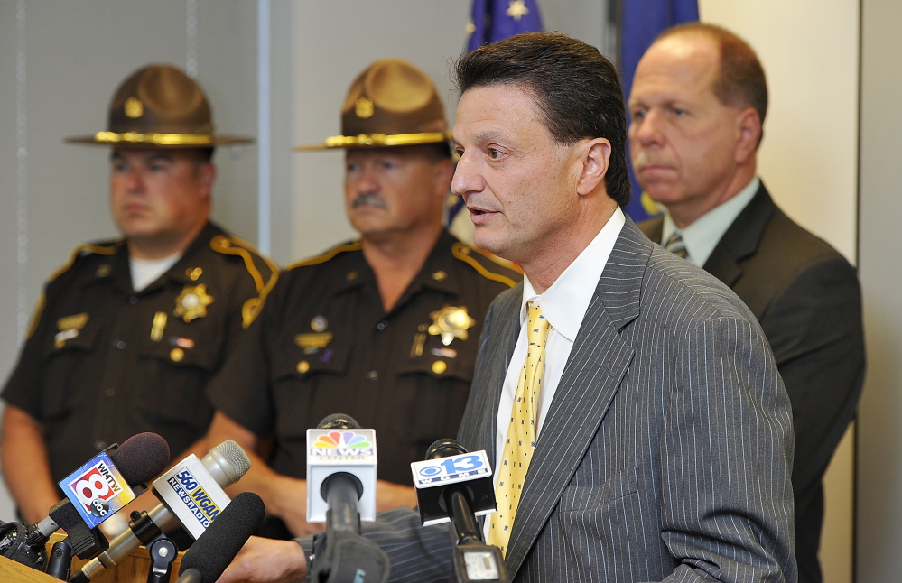 Attorney Peter Marchesi speaks to the media about the $2 million lawsuit for a wrongful death filed by the widow of a Windham man shot by a deputy. Behind him is, from left, Capt. Donald Goulet, Chief Deputy Naldo Gagnon and Sheriff Kevin Joyce. Marchesi represents the deputy and the sheriff’s office.