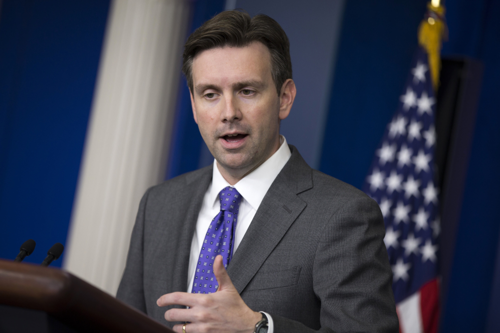 White House Press Secretary Josh Earnest answers a question about temperature screenings at five airports for passengers arriving from West Africa, an effort to prevent Ebola from spreading.