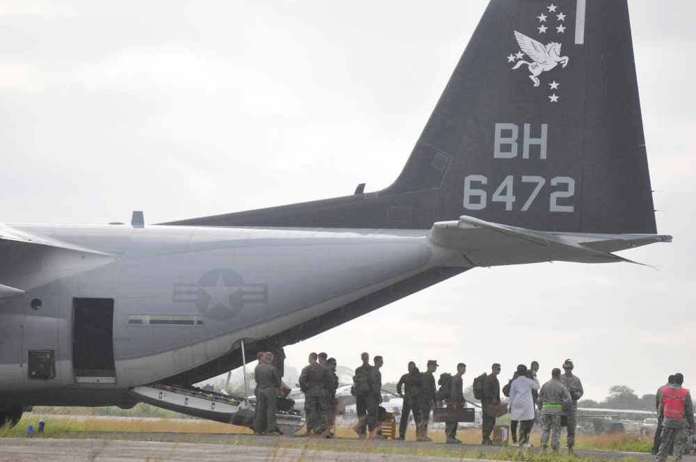 U.S Marines disembark upon their arrival Thursday at Roberts International airport in Monrovia, Liberia. Six U.S. military planes arrived Thursday at the epicenter of the Ebola crisis, carrying more aid and Marines into Liberia, the country hardest hit by the deadly disease.