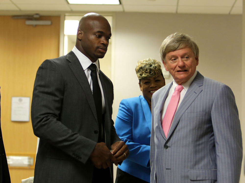 Minnesota Vikings running back Adrian Peterson, seen in court Wednesday with attorney Rusty Hardin and his mother, said during his court appearance on a child abuse charge that he had “smoked a little weed” while free on bond, Texas prosecutors said Thursday.