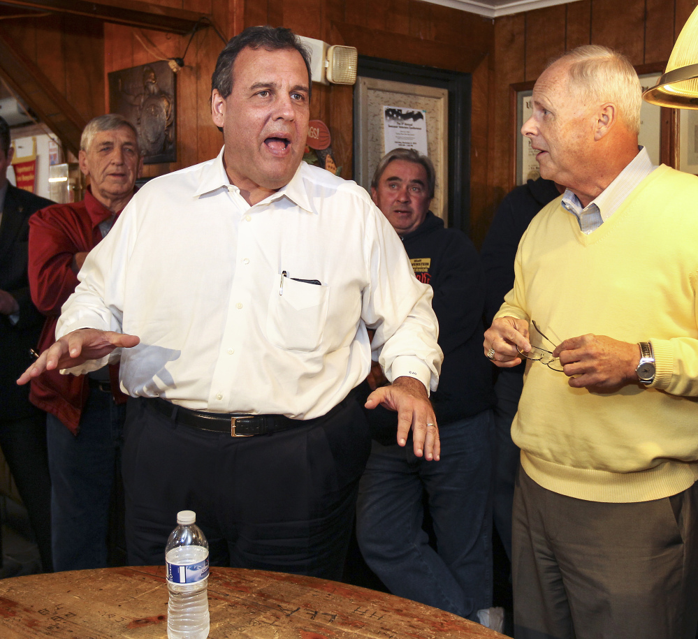 New Jersey Gov. Chris Christie, left, campaigns with Republican gubernatorial candidate Walt Havenstein on Friday in Lancaster, N.H. Earlier Friday, Christie stumped for GOP gubernatorial candidate Alan Fung in Rhode Island.