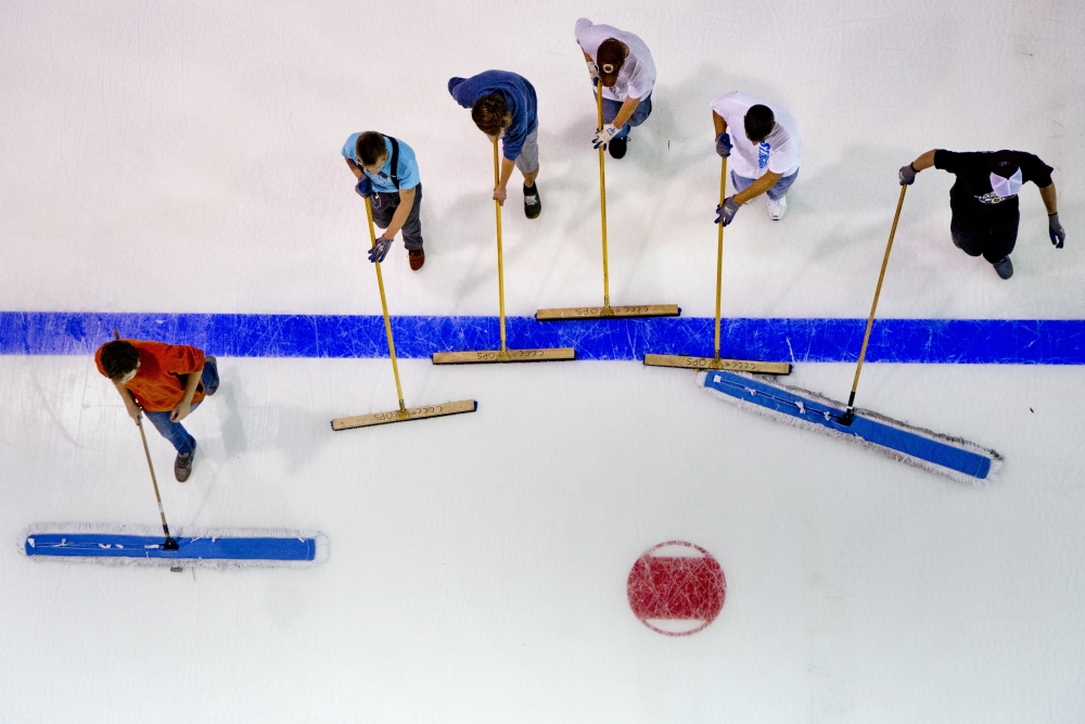 The crew at the Cross Insurance Arena in Portland sweeps the ice as they prepare for the season-opening game Saturday when the Portland Pirates will host the Providence Bruins, marking the home team’s return to Portland after a disastrous season in Lewiston.