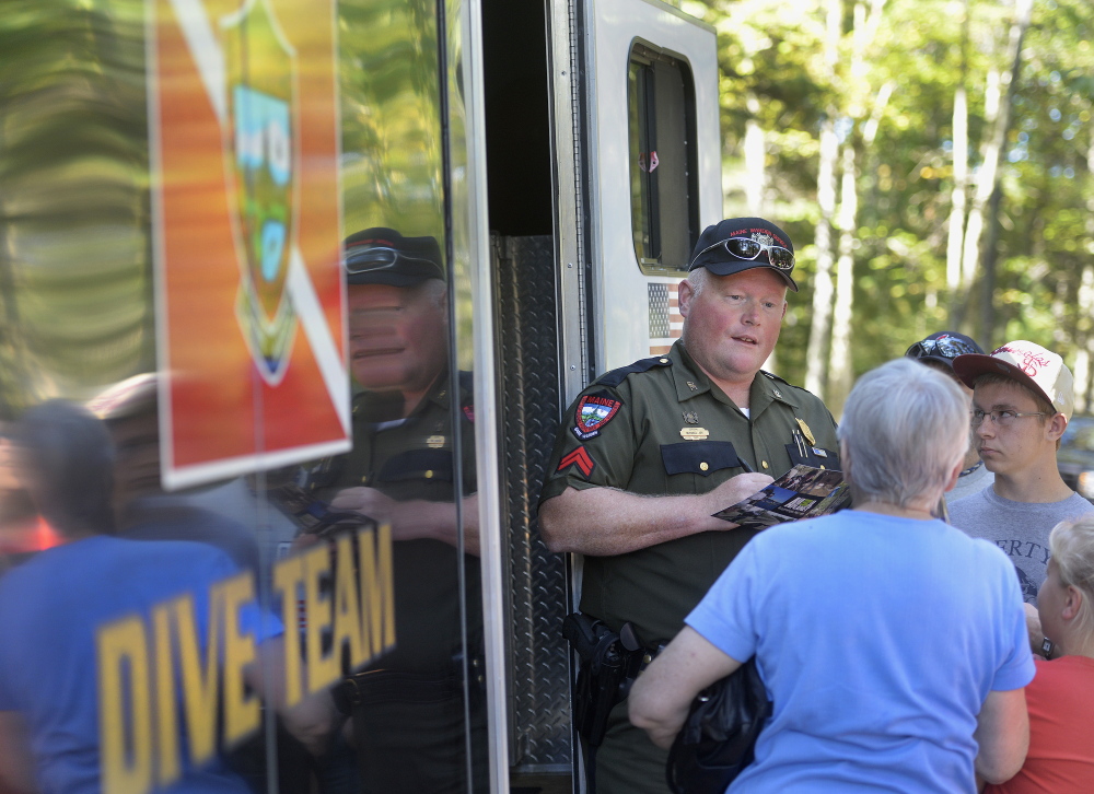Warden Michael Joy, a member of the dive team, is at ease putting himself at risk in Maine’s waterways – and meeting fans of “North Woods Law” during a meet-and-greet last month in Gray.