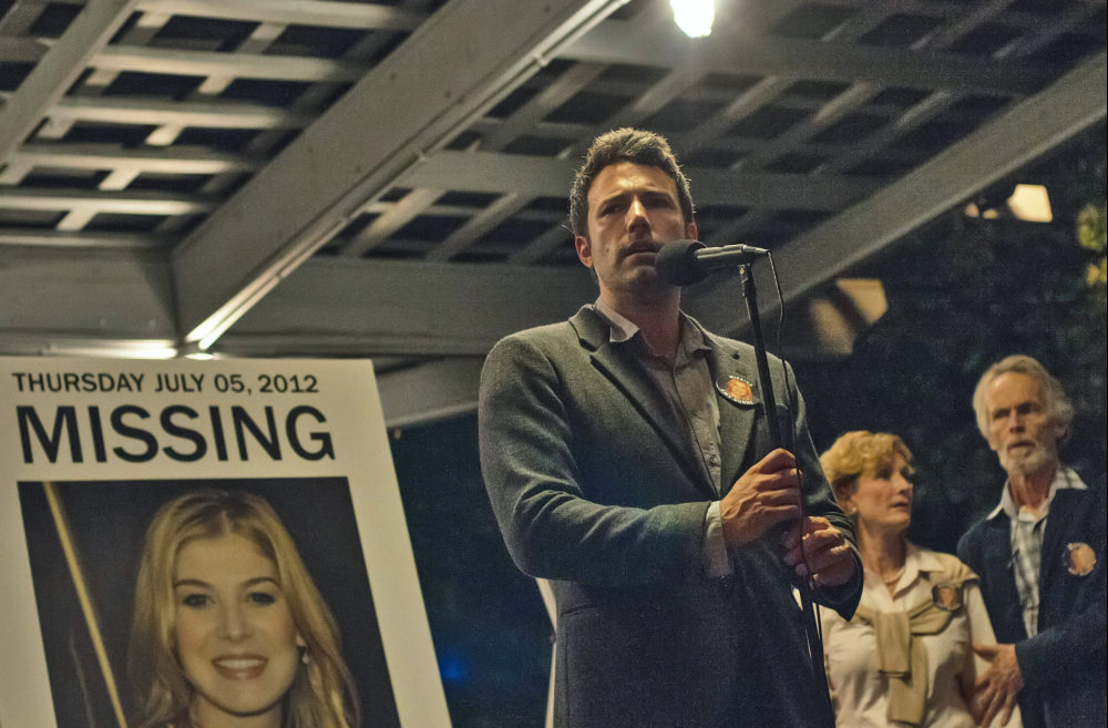 Ben Affleck, right, stars in “Gone Girl,” which grossed about $26.8 million in sales this weekend.