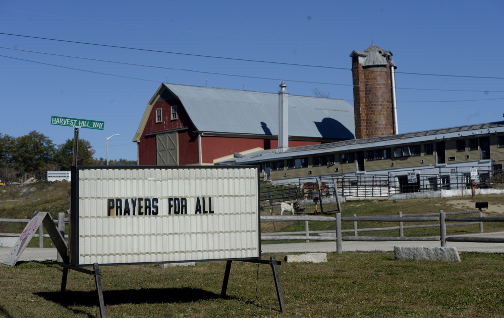 A sign along Route 26 at Harvest Hill Farms Monday marks the tragic hayride accident that occurred Saturday night. Shawn Patrick Ouellette/Staff Photographer)