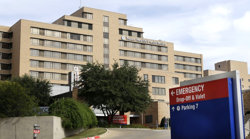 A sign points to the entrance to the emergency room at Texas Health Presbyterian Hospital Dallas, where U.S. Ebola patient Thomas Eric Duncan was being treated, in this Oct. 8, 2014 file photo, in Dallas.