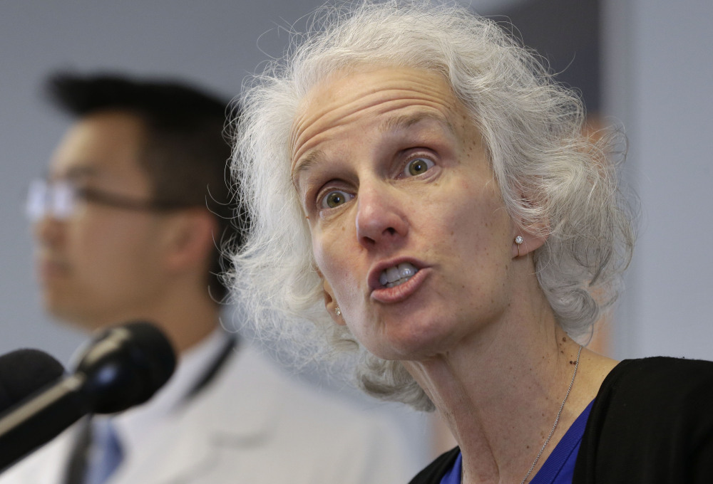 Dr. Anita Barry, head of the Infectious Disease Bureau at the Boston Public Health Commission, right, takes questions from members of the media Monday with Huy Nguyen, medical director and interim executive director of Boston Public Health Commission.
