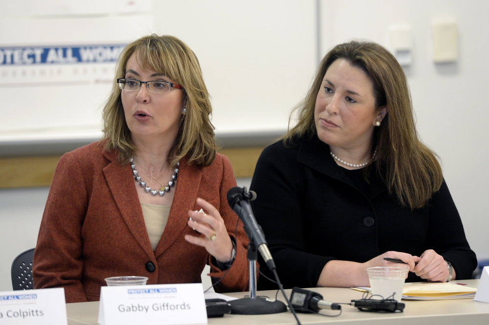 Former U.S. Rep. Gabby Giffords, left, said Tuesday that “stalkers with guns, abusers with guns ... make gun violence a women’s issue. ... We can change our laws.” Listening is Hayley Zachary of Americans for Responsible Solutions.