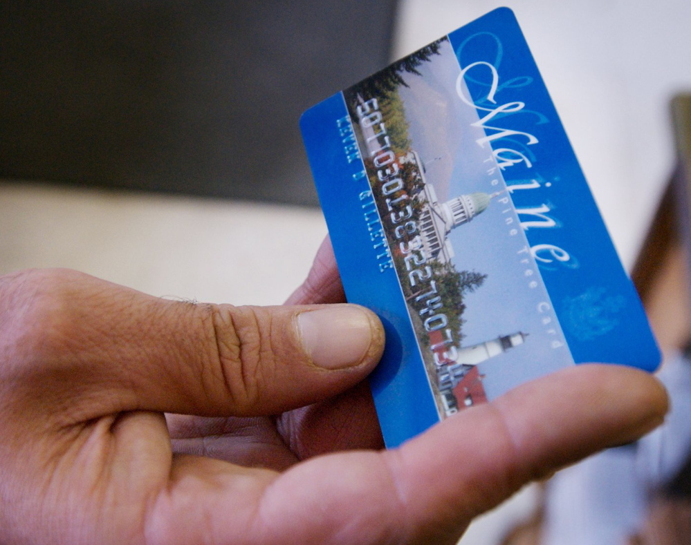A Portland man uses a magnetic food stamp card to buy his groceries in August 2008.