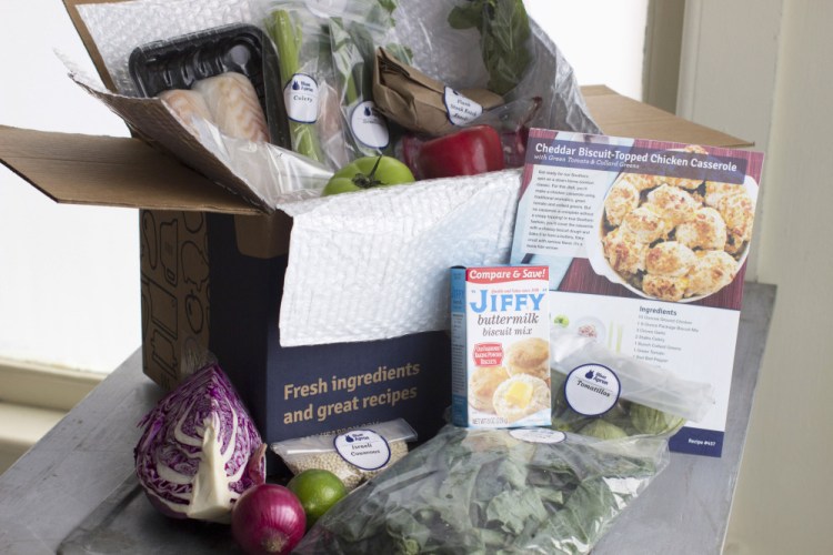 A home delivered meal from New York-based Blue Apron. A bevy of new online services is angling to be a virtual kitchen assistant, giving the chance to outsource the tedious aspects of cooking so that customers can focus on the more satisfying assembling and eating parts.