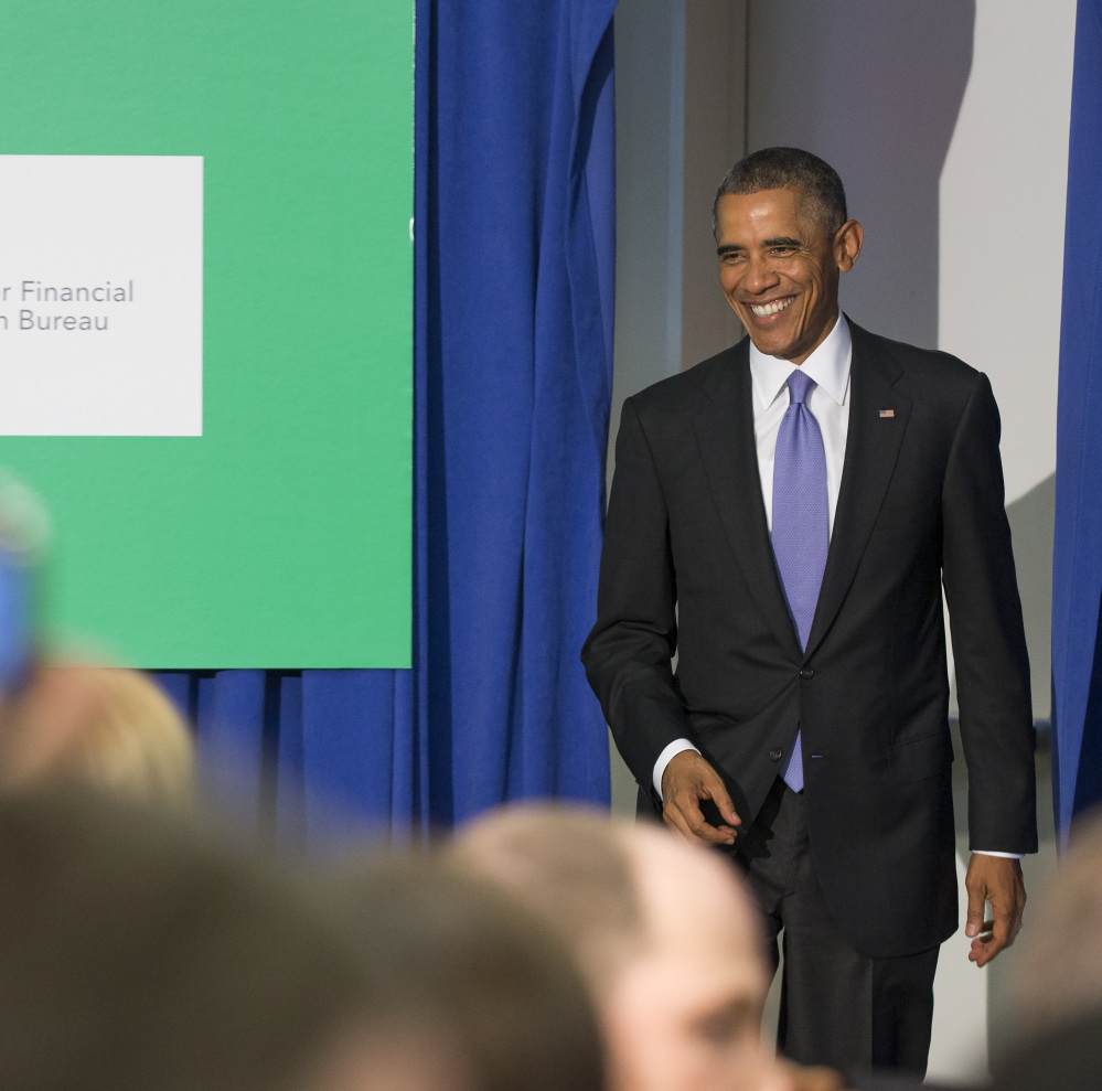 President Barack Obama arrives at the Consumer Financial Protection Bureau in Washington on Friday.