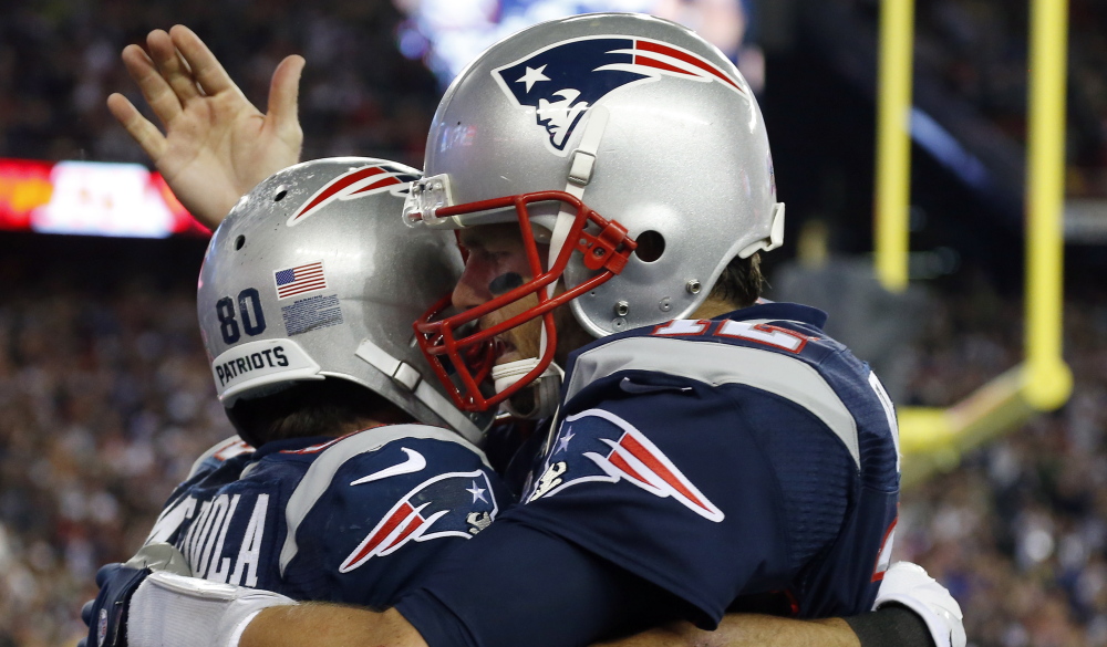 Receiver Danny Amendola, left, has had his issues fitting in with the New England Patriots’ offense, but earned congratulations from Tom Brady on Thursday after hauling in a touchdown pass during the narrow victory over the New York Jets.
