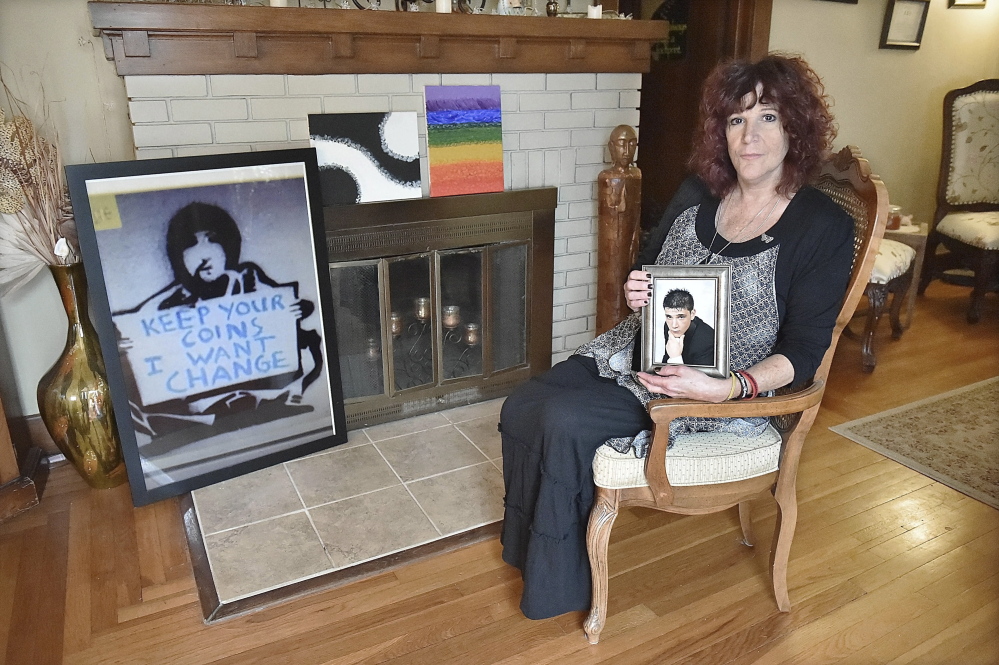 Judy Murray of East Haven, Conn., holds a high school portrait of her son, Dan Kelson, who committed suicide in May at the age of 23. Prior to his suicide, he had been released from a hospital too soon, in Murray’s opinion. She is the founder of “Don’t Accept No.”
The Associated Press/New Haven Register