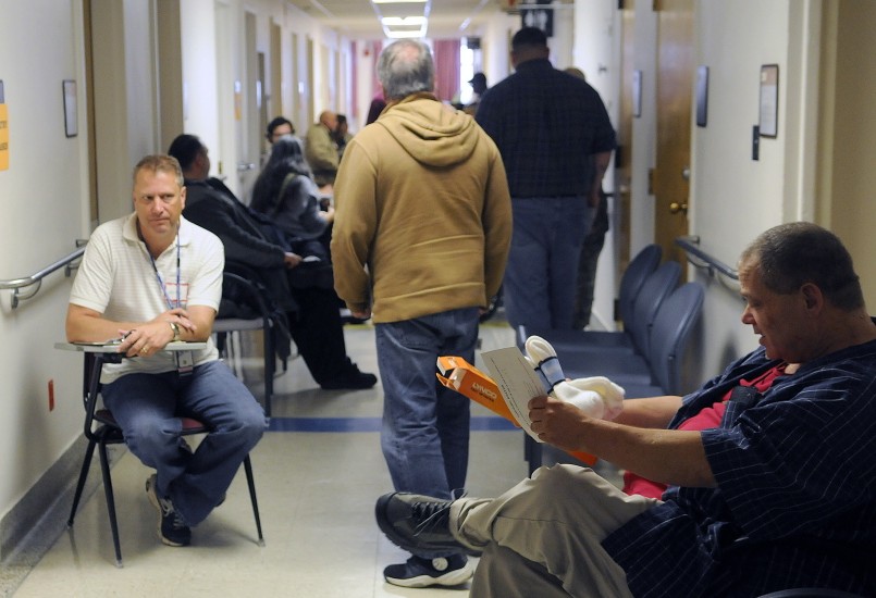 Veterans line up to receive medical care during the Homeless Veterans Stand Down at the Togus veterans’ hospital in October 2014. A rule change proposed by the Department of Veterans Affairs would reduce wait times for veterans to receive care.