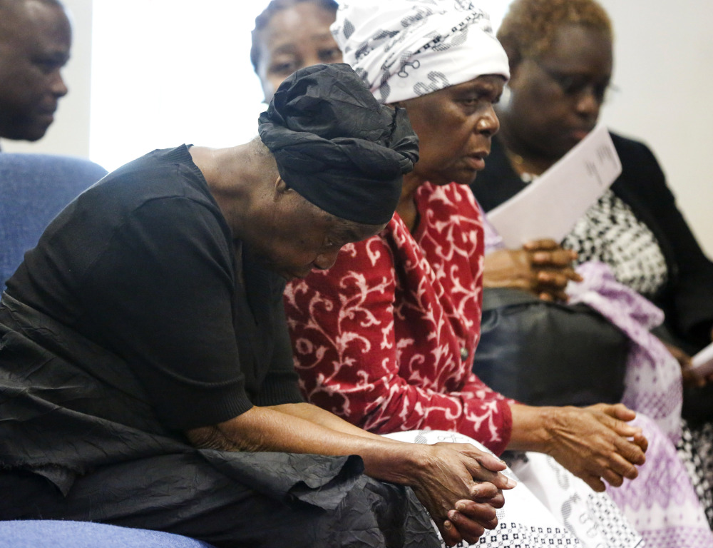 Garteh Korkoryah, left, mother of Thomas Eric Duncan, grieves at her son’s memorial service on Saturday in Salisbury, N.C. Duncan died of Ebola in Dallas on Oct. 8.