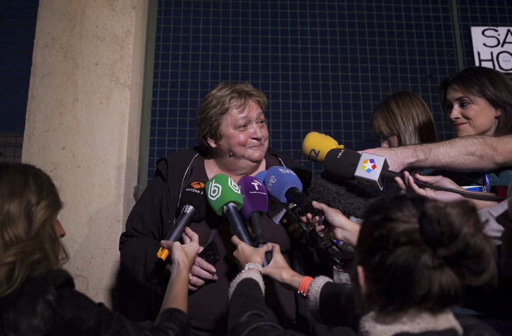 Teresa Mesa, center, spokesperson of Ebola patient Teresa Romero attends the media in front of the Carlos III Hospital in Madrid, Spain.