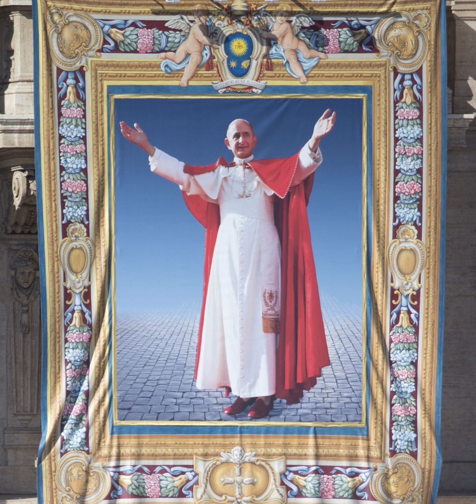 A tapestry of Pope Paul VI is displayed Sunday on St. Peter’s Basilica during a beatification ceremony and Mass at the closing of a two-week synod on family issues at the Vatican.
