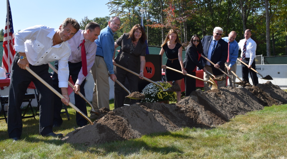 Members of the Wells-Ogunquit Community School District staff and student body and town officials take part in the  groundbreaking ceremony for the expansion project at Wells High School. From left are Steve Kayser, teacher; Zak Harding,  building committee co-chair; Jon Carter, Wells town manager; Ellen Schneider, WOCSD superintendent; Ally O’Brien, student; Helena Ackerson, school committee chair; state Sen. Ron Collins; Josh Gould, building committee co-chair; and principal Jim Daly.
