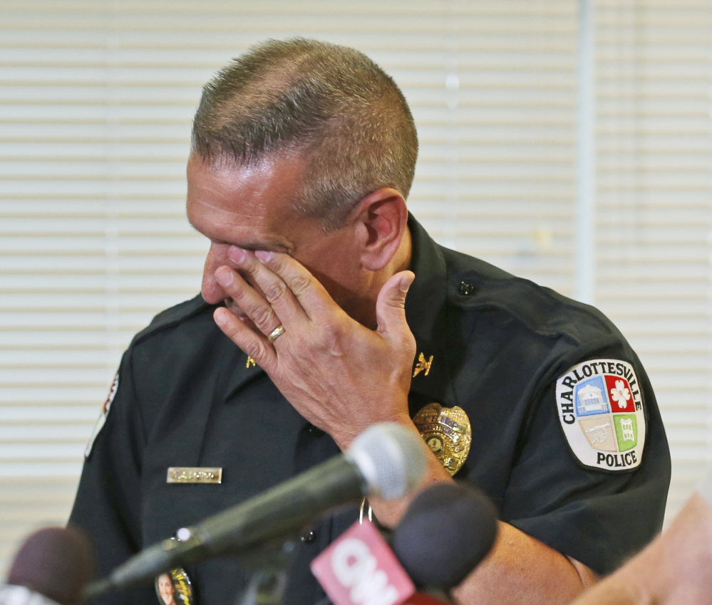 Charlottesville Police Chief Tim Longo wipes his eyes as he briefs the media on the discovery of human remains in Albermarle County during a news conference in Charlottesville, Va., on Saturday.