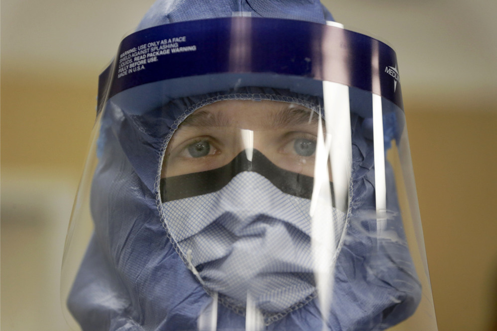 Registered nurse Keene Roadman stands dressed in personal protective equipment during a training class at the Rush University Medical Center in Chicago. The Centers for Disease Control and Prevention released new guidelines Monday for how health workers should gear up to treat Ebola patients.