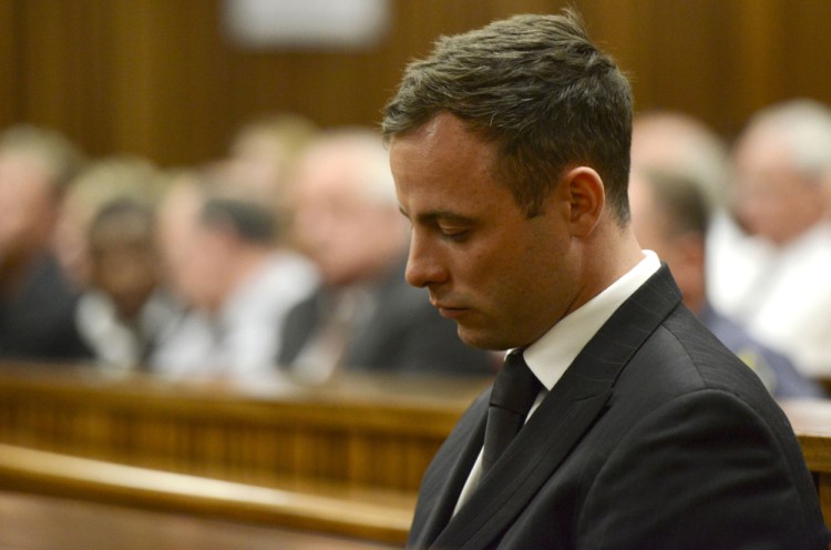In this October 2014, Oscar Pistorius sits in court in Pretoria, South Africa after judge Thokozile Masipais sentenced him to five years in prison for culpable homicide in the killing of his girlfriend, Reeva Steenkamp.