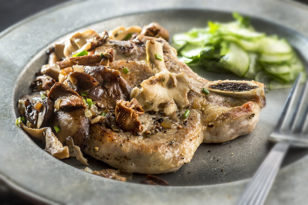 Smother golden pork chops with a variety of sauteed mushrooms for a range of textures.