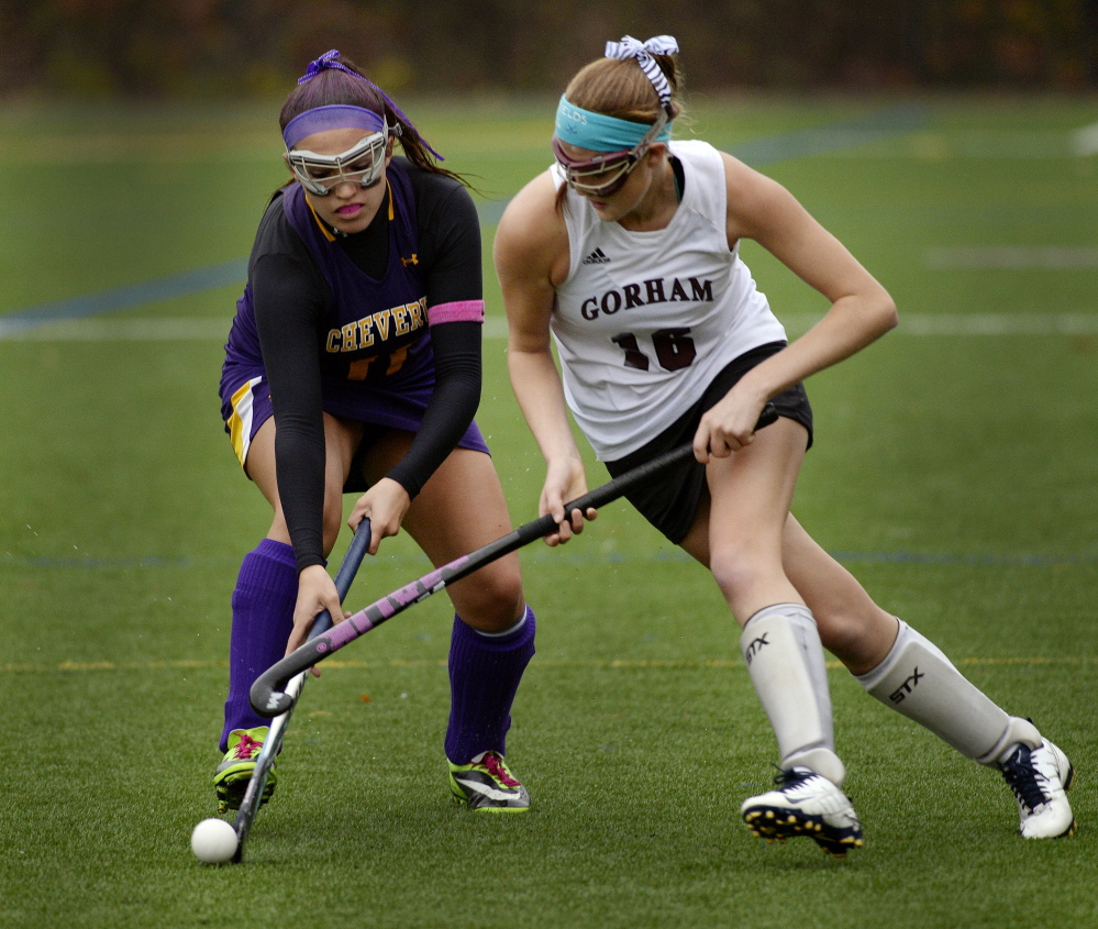 GORHAM, ME - OCTOBER 21: Carrie Hight of Cheverus and Maggie Shields of Gorham battle for the ball in field hockey action Tuesday, October 21, 2014. (Photo by Shawn Patrick Ouellette/Staff Photographer)