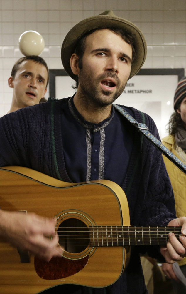 Andrew Kalleen joins other performers during a protest in the Metropolitan Avenue Subway station Tuesday.