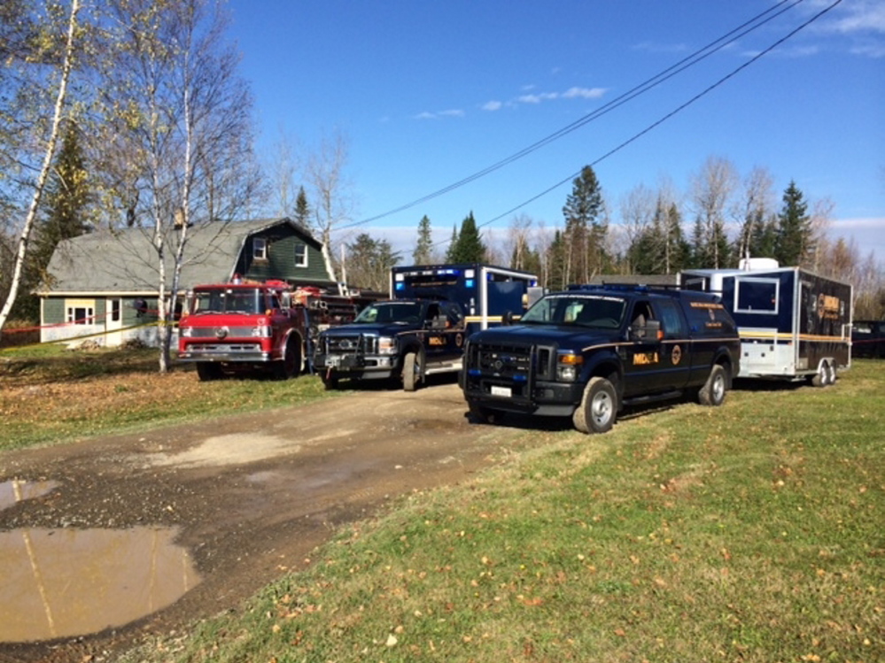 Members of the Maine Drug Enforcement Agency investigate an alleged methamphetamine operations in Monticello and East Millinocket.