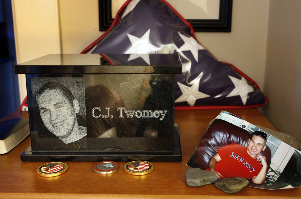 An urn containing the ashes of C.J. Twomey sits on a shelf at his parent’s home in Auburn in December. A vial of his ashes was aboard a rocket launched from the New Mexican desert into space before landing in the White Sands Missile Range on Thursday.
