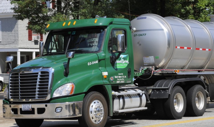 A Poland Spring tanker truck rolls through Fryeburg. The Maine Supreme Judicial Court has affirmed regulators' approval of a contract allowing the Fryeburg Water Co. to sell water to Nestle Waters, which owns Poland Spring.