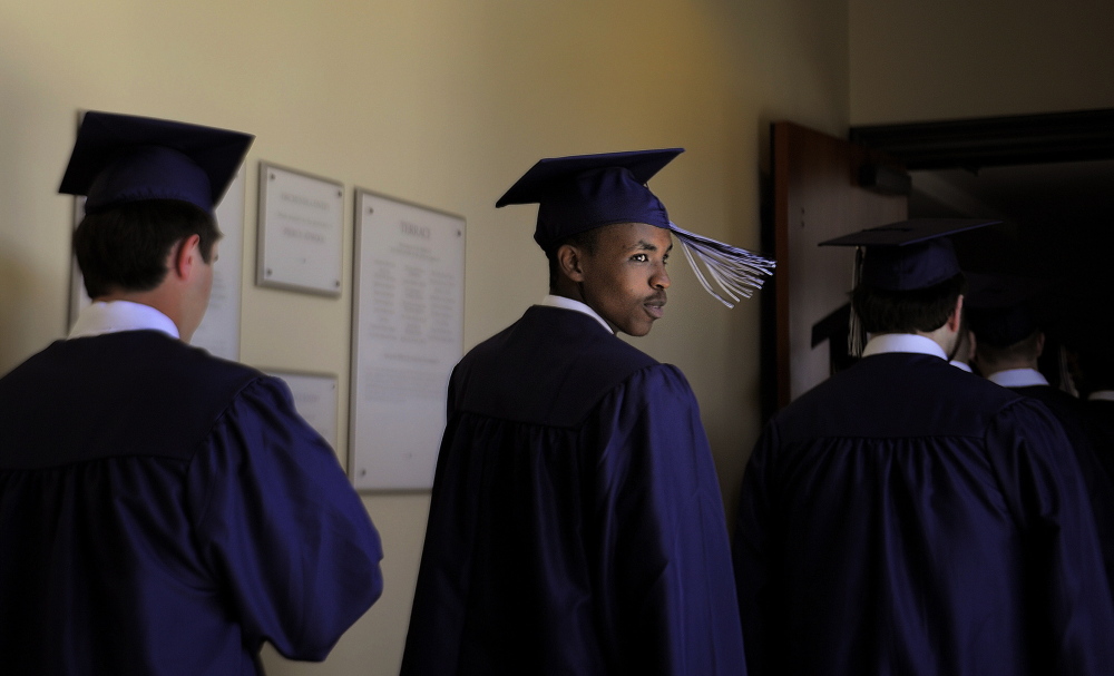 Portland High School graduates line up during commencement in 2013. Educate Maine hopes to boost the state’s high school graduation rate from 86 percent to 90 percent.