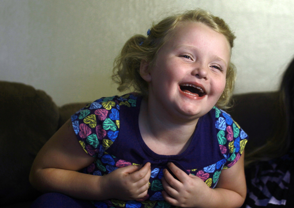 Alana Thompson, now 9, laughs during an interview at her home in McIntrye, Ga. She’s the title character in the TLC hit show “Here Comes Honey Boo Boo.”