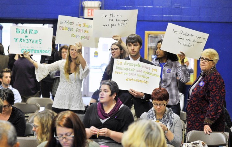 Unhappy students of the French department protest the elimination of the department led by Nancy Erickson, right, associate professor of French, as students and instructors speak before the UMaine System Board of Trustees voted to cut programs and staff because of budget shortfalls.