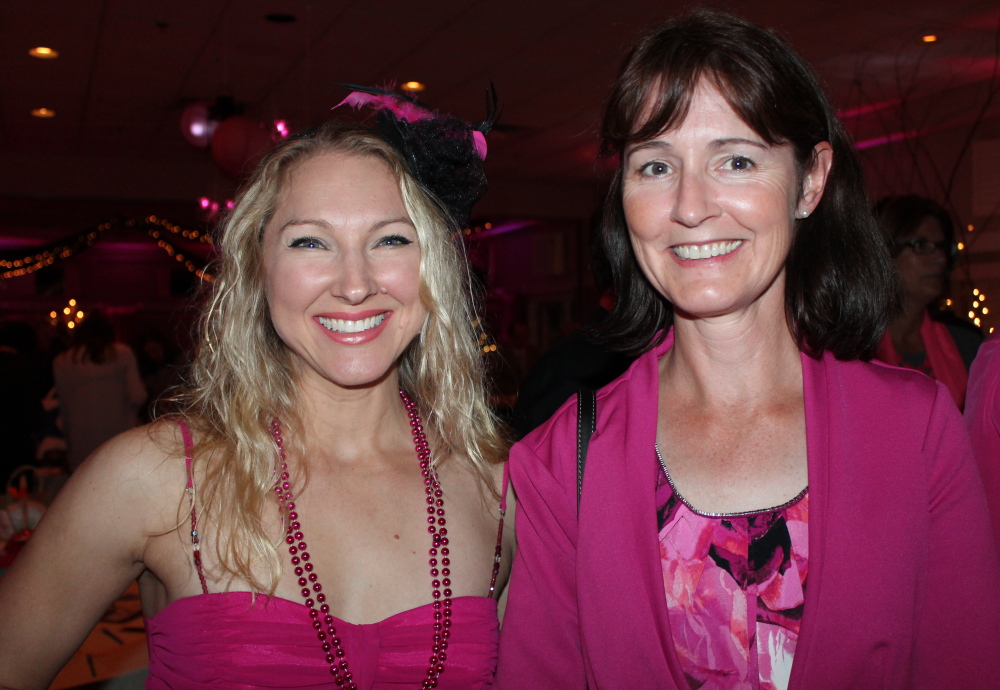 Nicole Bezanson, left, a Witches Wear Pink committee member, celebrates a successful evening with Alison Curran of Falmouth.