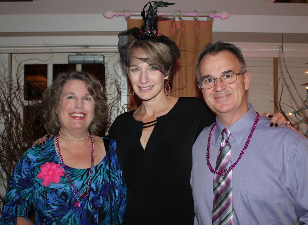 Kelly Martin, left, special events manager at the Maine Cancer Foundation, and her husband Randy with emcee Shannon Moss, center.