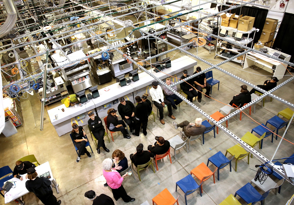 Workers await tasks at McDonald’s 38,000-square-foot Innovation Center in Romeoville, Ill. Eighty crew members and five managers work in the warehouse’s test restaurants.