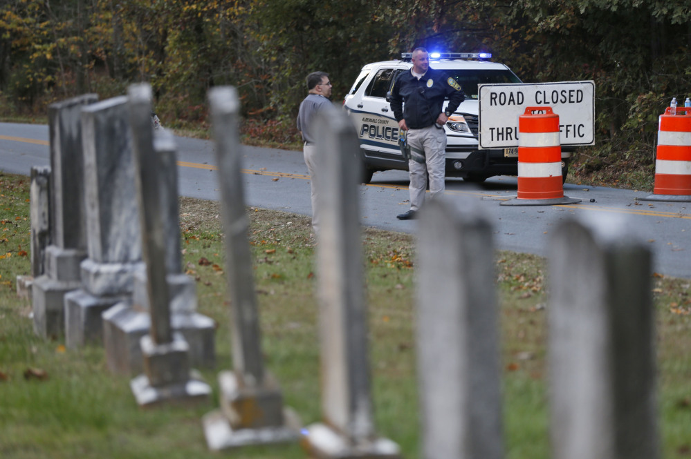 Police block the road leading to the scene of a death investigation in connection with the disappearance of University of Virginia student Hannah Graham in Albermarle County, Va., on Oct. 18. The remains found there are those of Hannah Graham, authorities said Friday