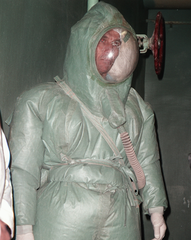 A Russian scientist wears a protective suit that was used while working on military research into deadly viruses, including Ebola, in 2002.