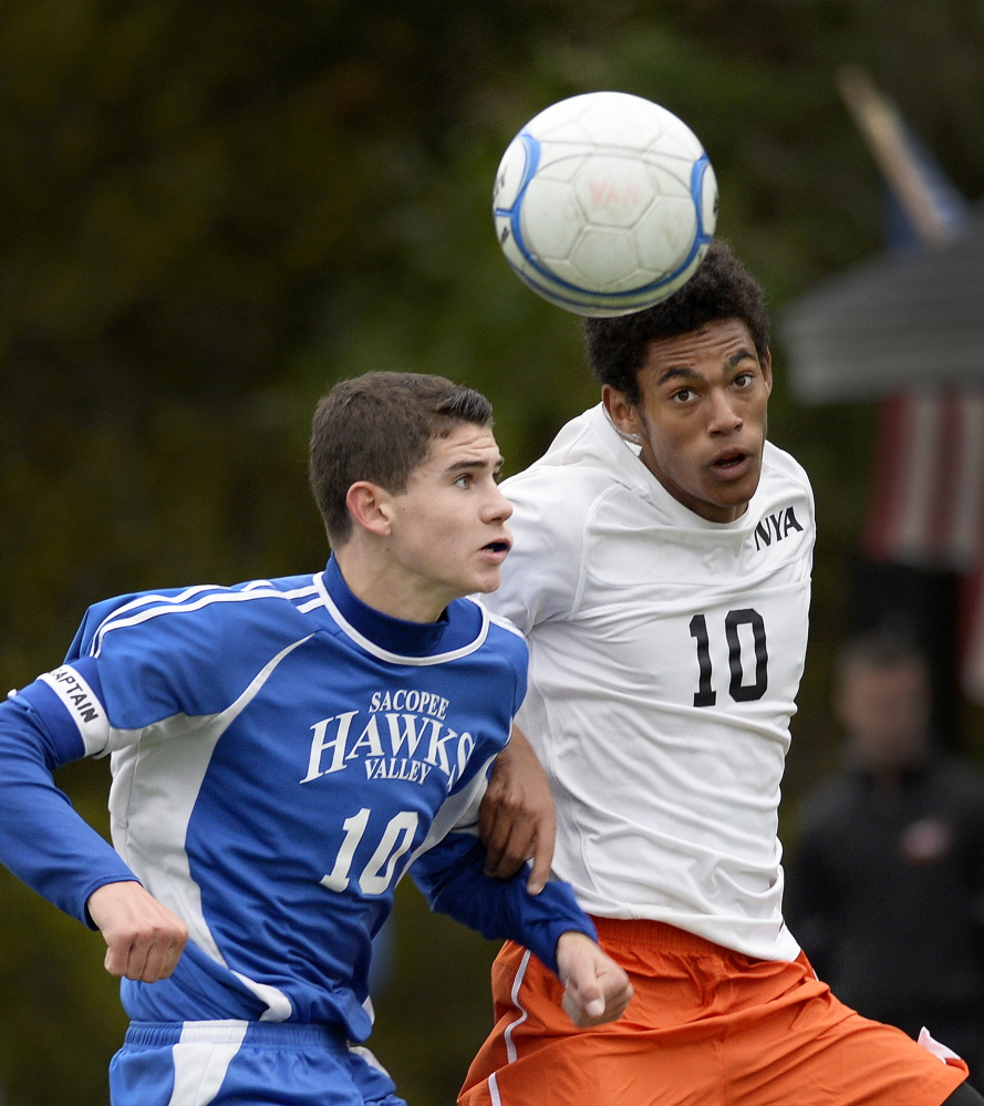 Sacopee Valley’s Blake Trueworthy, left, and North Yarmouth Academy’s DJ Nicholas battle for the ball during Friday’s Western Class C boys’ soccer prelim game at Yarmouth. The Hawks won 1-0 to advance to the quarterfinals.