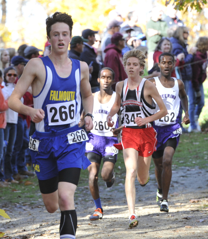 Bryce Murdick of Falmouth leads Scarborough’s Jacob Terry (345) and Deering’s Yahye Hussein (260) and Iid Sheikh-Yusuf (262) during the Class A boys’ race Saturday at the Western Maine cross country regionals in Cumberland. Sheikh-Yusuf won the race, followed by Terry, Murdick and Hussein.