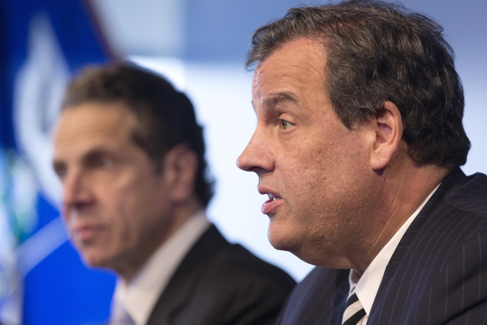 New Jersey Gov. Chris Christie, right, seen with New York Gov. Andrew Cuomo, should show that a quarantine is medically necessary, the ACLU says.
The Associated Press