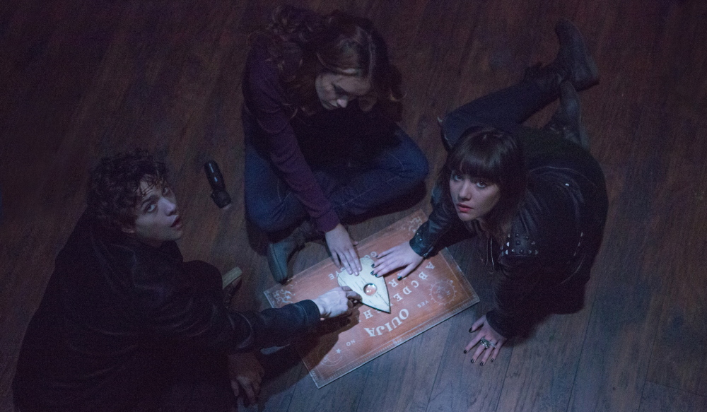 From left, Douglas Smith, Olivia Cooke and Ana Coto appear in Universal Pictures'  “Ouija.” 