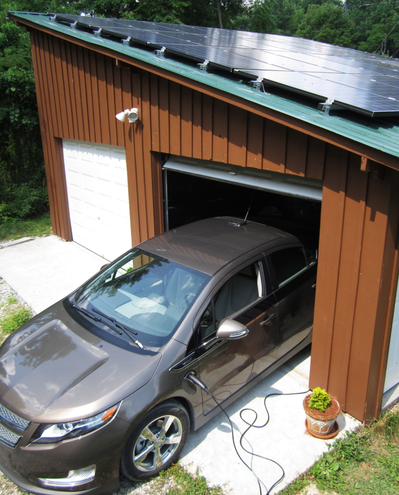 Samuel Avery’s Chevy Volt plug-in charges in his garage in Hart County, Ky. A growing number of electric-vehicle owners are powering their cars with solar energy from panels on their homes.